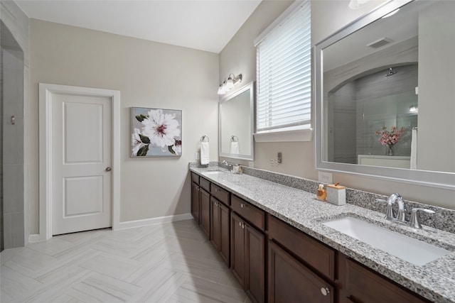 bathroom featuring vanity and walk in shower