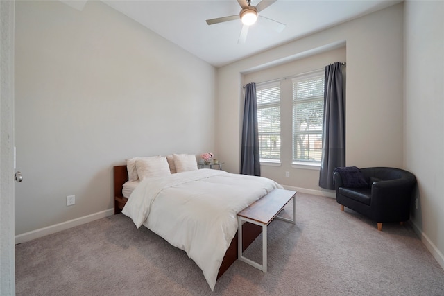 bedroom with ceiling fan, light colored carpet, and lofted ceiling