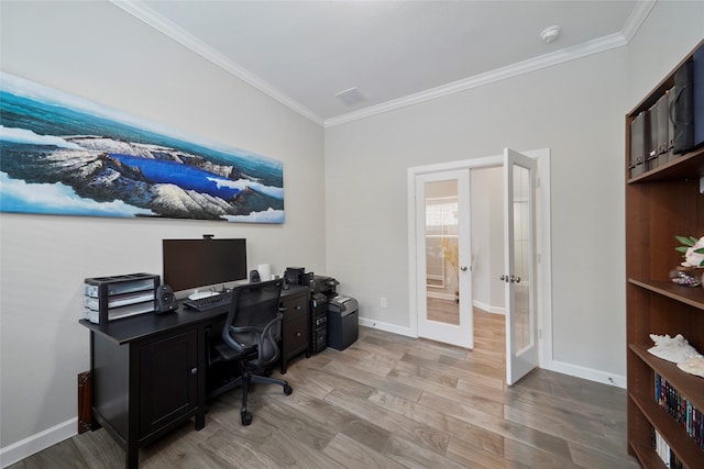 office with crown molding, light hardwood / wood-style floors, and french doors