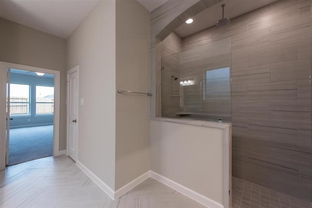 bathroom featuring a tile shower