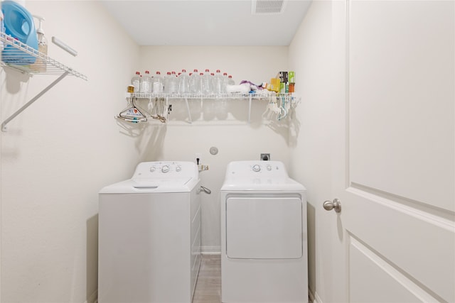 laundry room with washing machine and dryer