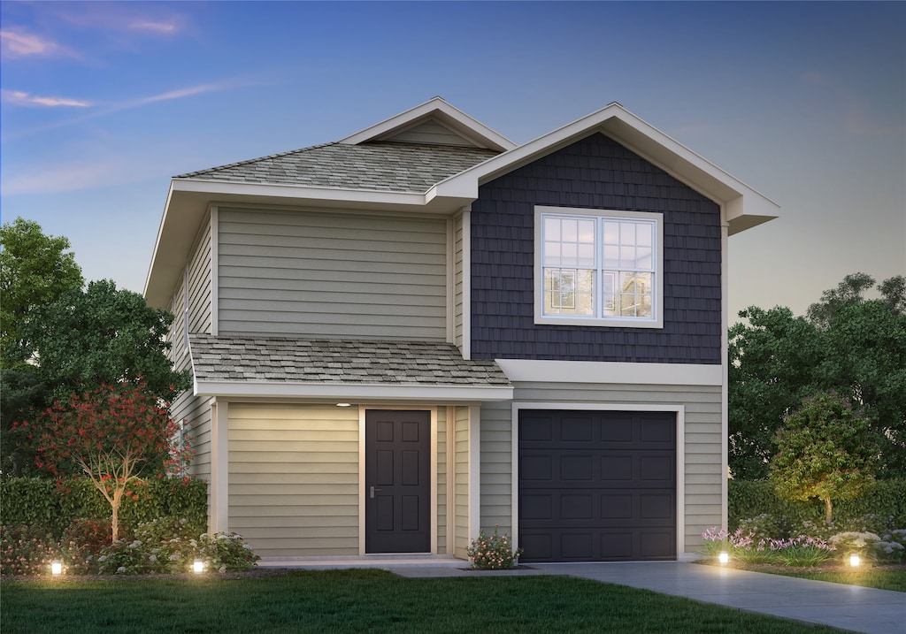 traditional home featuring driveway and an attached garage