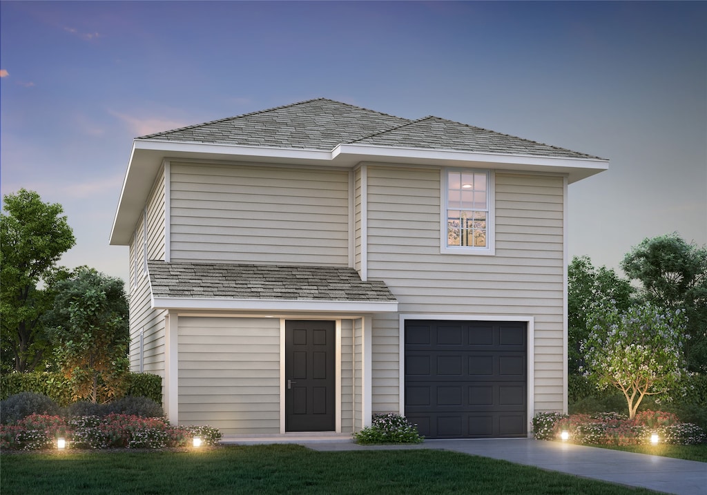 traditional-style house with a garage and driveway