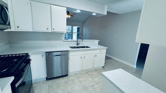 kitchen with white cabinets, ceiling fan, sink, and stainless steel appliances