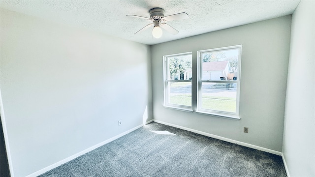 carpeted empty room with a textured ceiling and ceiling fan