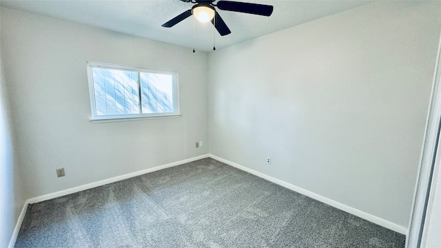 spare room featuring carpet and ceiling fan