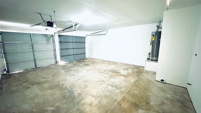 garage featuring a garage door opener and water heater