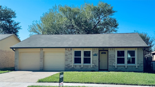 view of front facade with a garage and a front yard