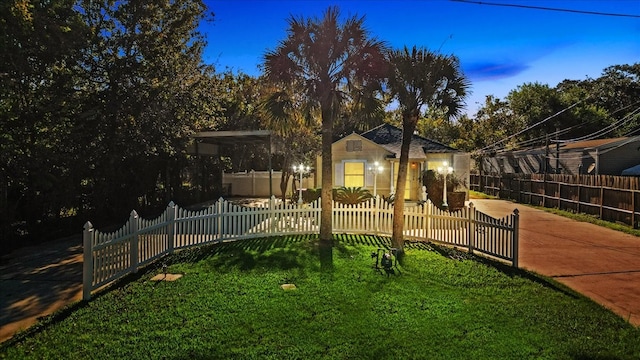 view of yard at dusk