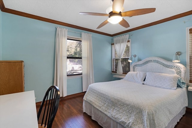 bedroom featuring ceiling fan, crown molding, and dark wood-type flooring