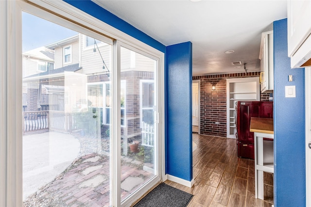 doorway to outside with hardwood / wood-style flooring