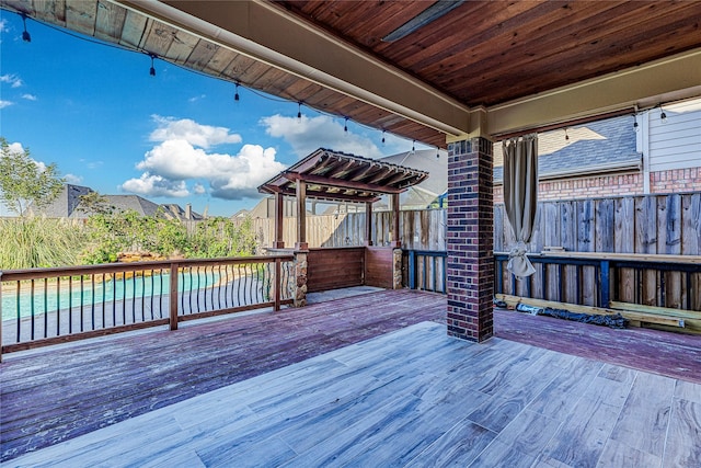 deck with a fenced in pool