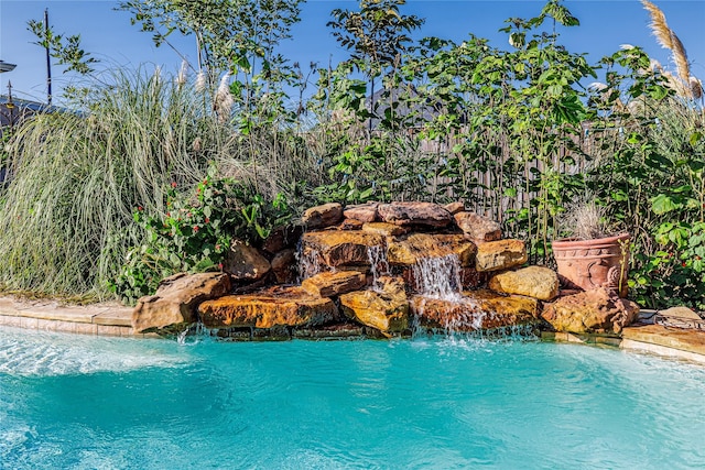 view of pool featuring pool water feature