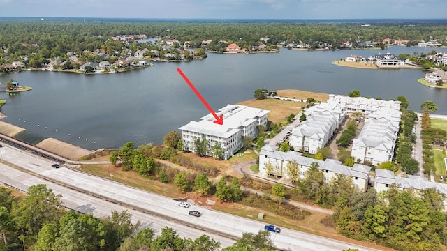 birds eye view of property with a water view