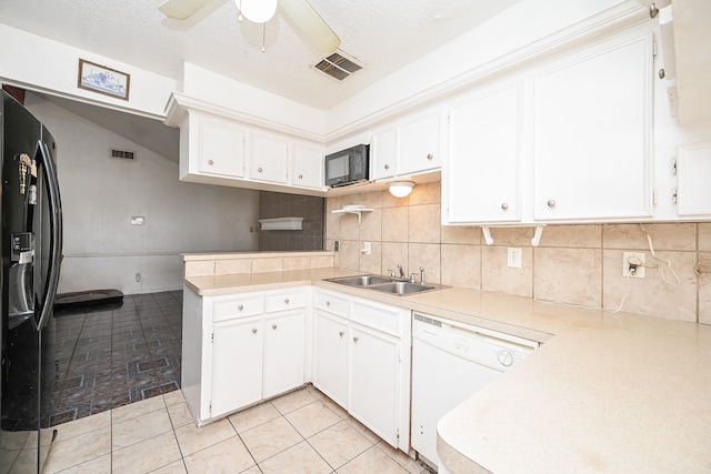 kitchen with white cabinets, sink, and black appliances