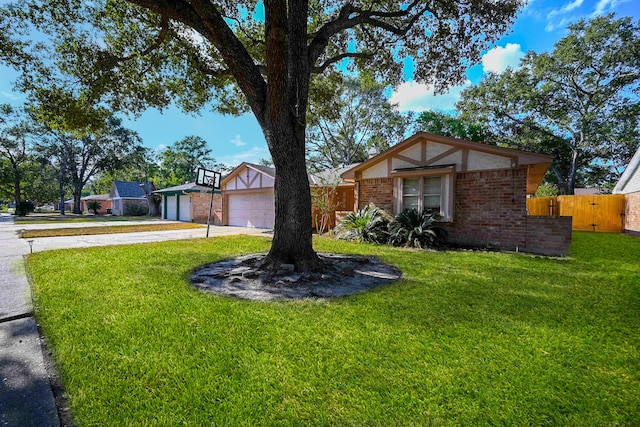 view of front facade featuring a garage and a front lawn