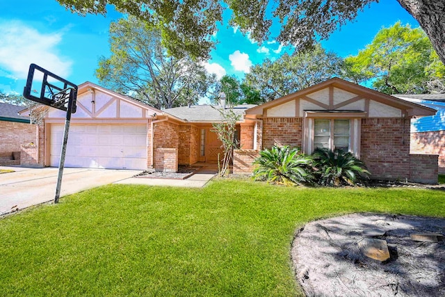 view of front of property with a front yard and a garage