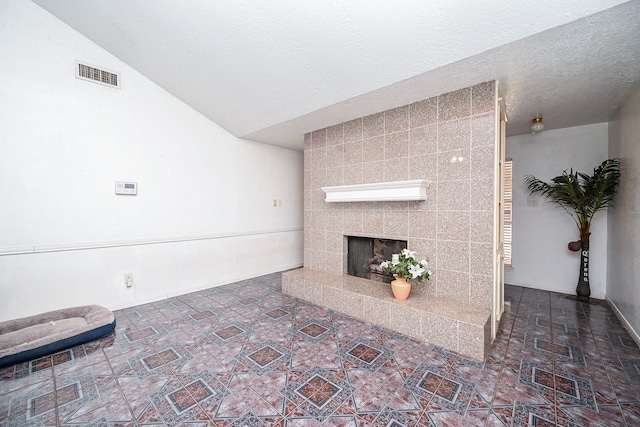 unfurnished living room featuring a fireplace and vaulted ceiling