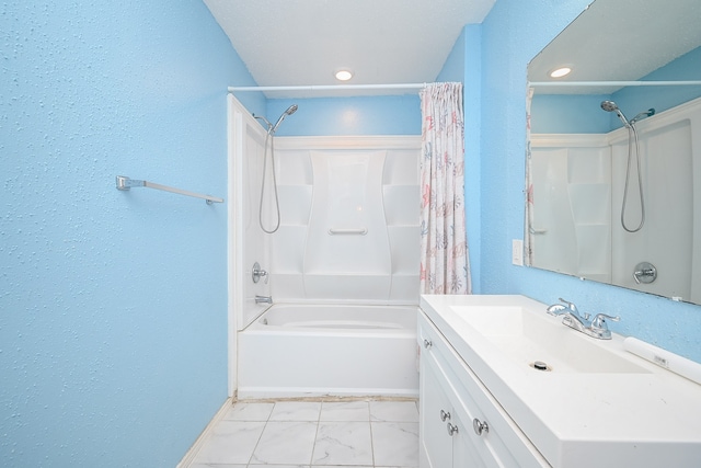 bathroom featuring shower / bath combo with shower curtain and vanity