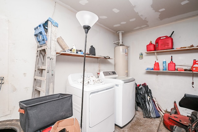 washroom featuring water heater and separate washer and dryer