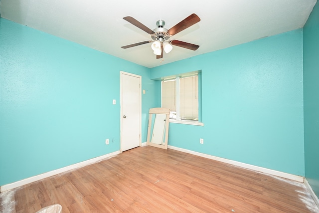 unfurnished bedroom with ceiling fan and light wood-type flooring