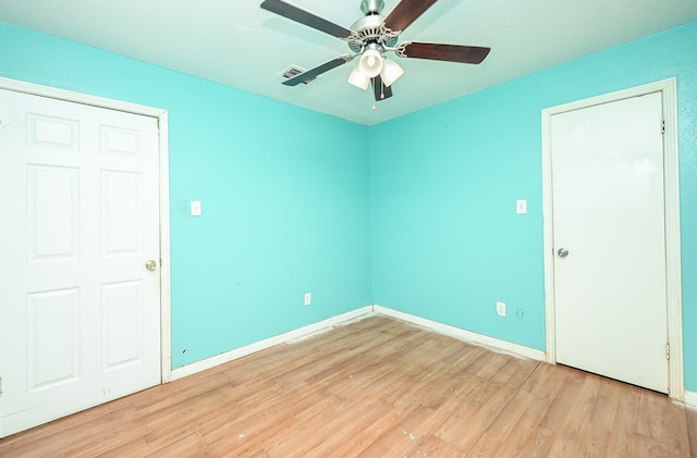 spare room featuring light hardwood / wood-style flooring and ceiling fan