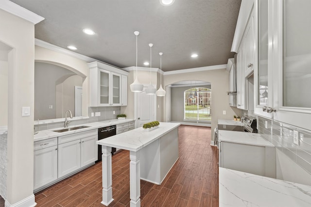 kitchen with white cabinetry, sink, dishwasher, and pendant lighting