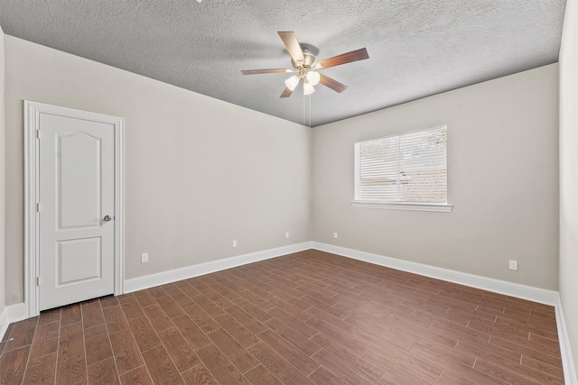 unfurnished room featuring a textured ceiling, dark hardwood / wood-style floors, and ceiling fan