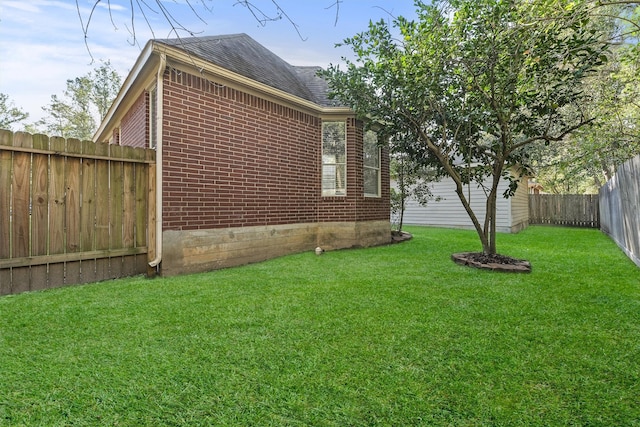 view of side of property with a yard