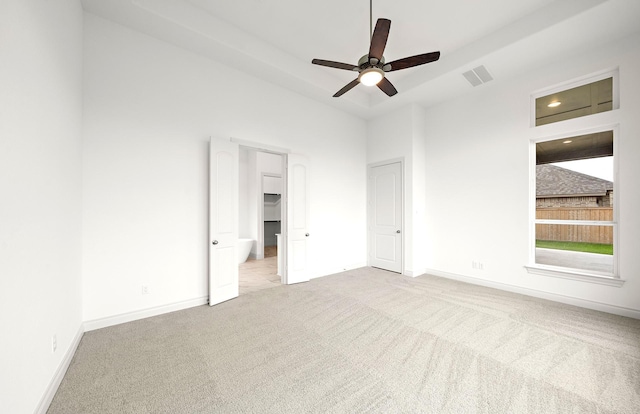 unfurnished bedroom featuring light carpet and ceiling fan