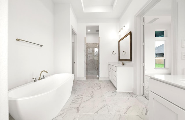 bathroom featuring vanity and separate shower and tub