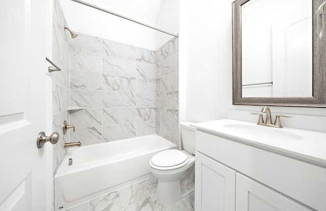 full bathroom with vanity, toilet, and tiled shower / bath