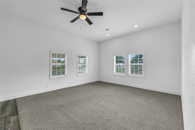 carpeted empty room featuring ceiling fan