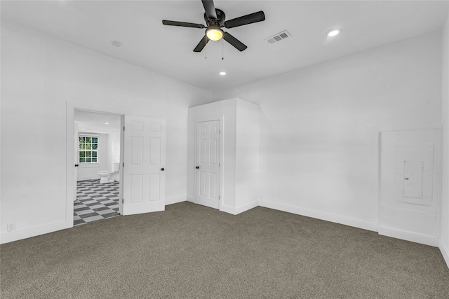 carpeted empty room with electric panel and ceiling fan