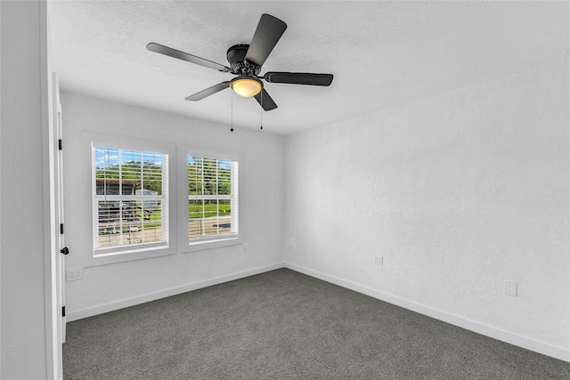 carpeted empty room with ceiling fan and a textured ceiling