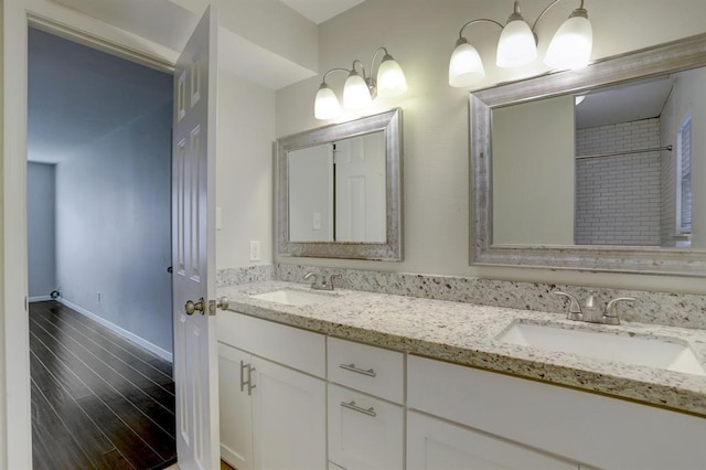 bathroom with vanity and wood-type flooring