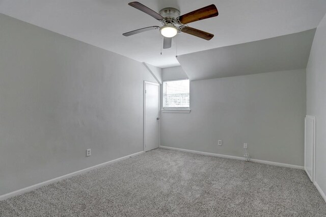 bonus room featuring light colored carpet, vaulted ceiling, and ceiling fan