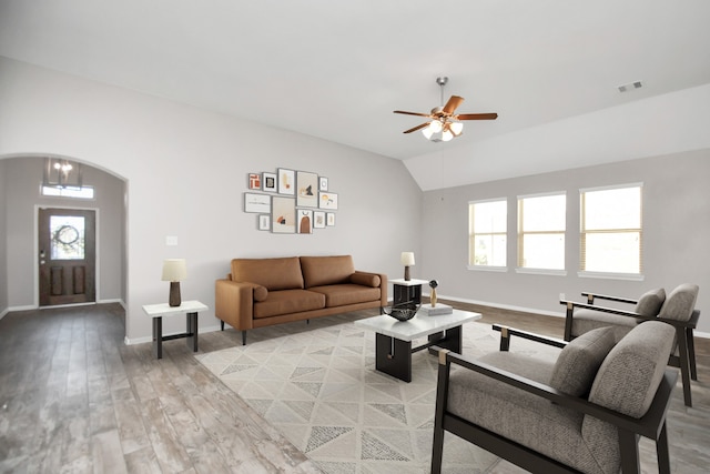 living room featuring vaulted ceiling, ceiling fan, and light hardwood / wood-style floors