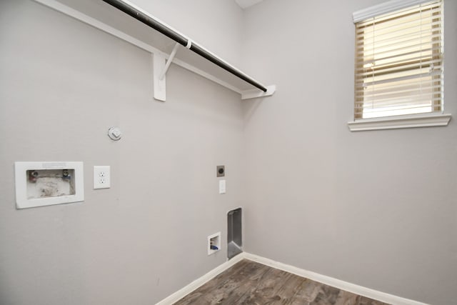 clothes washing area with dark hardwood / wood-style flooring, gas dryer hookup, hookup for a washing machine, and hookup for an electric dryer