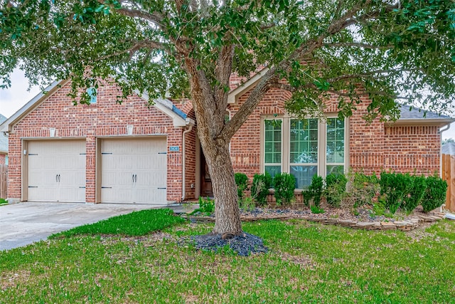 front facade featuring a front yard and a garage