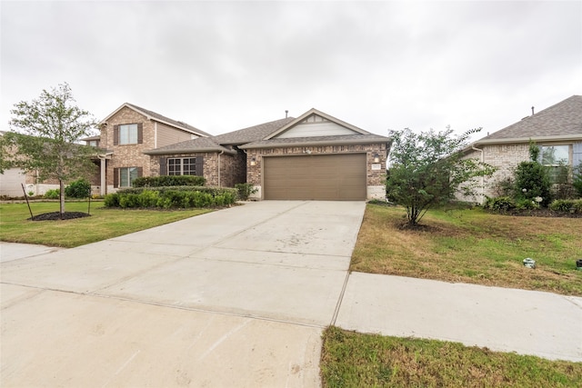 view of front of property with a front lawn and a garage