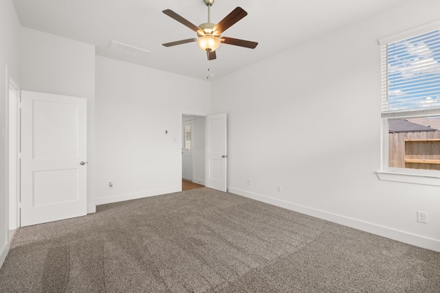 unfurnished bedroom featuring carpet flooring and ceiling fan