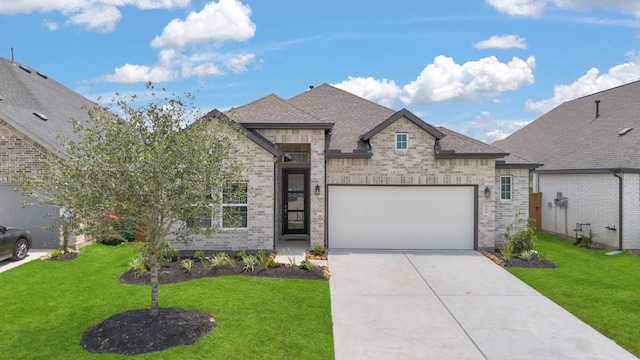 french provincial home with a garage and a front yard