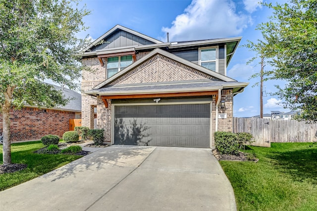 view of front of home featuring a front lawn and a garage