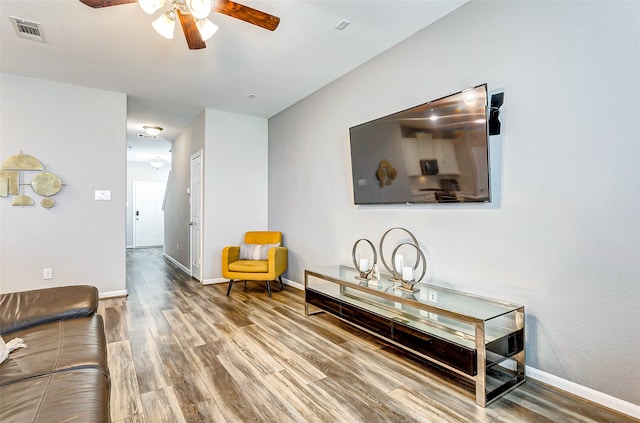 interior space featuring ceiling fan and wood-type flooring