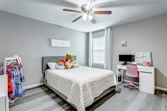 bedroom featuring ceiling fan and light hardwood / wood-style floors