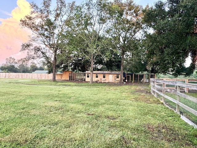 view of yard at dusk