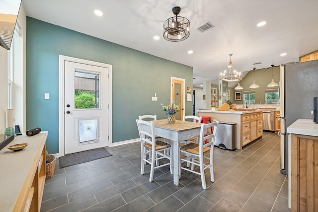 dining space featuring an inviting chandelier