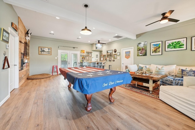 recreation room featuring french doors, hardwood / wood-style flooring, ceiling fan, pool table, and beam ceiling