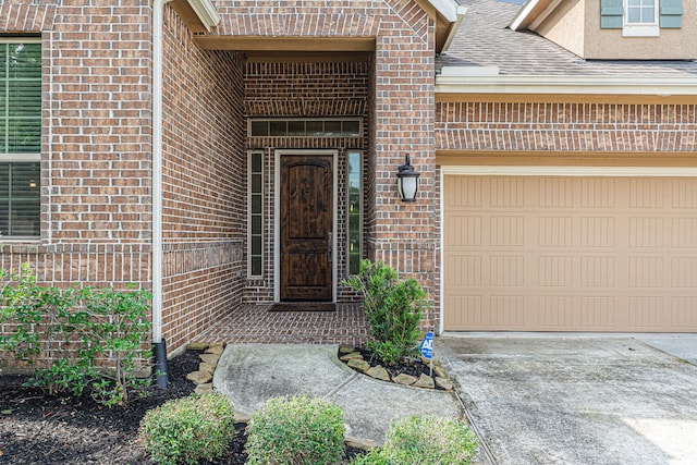 view of exterior entry featuring a garage